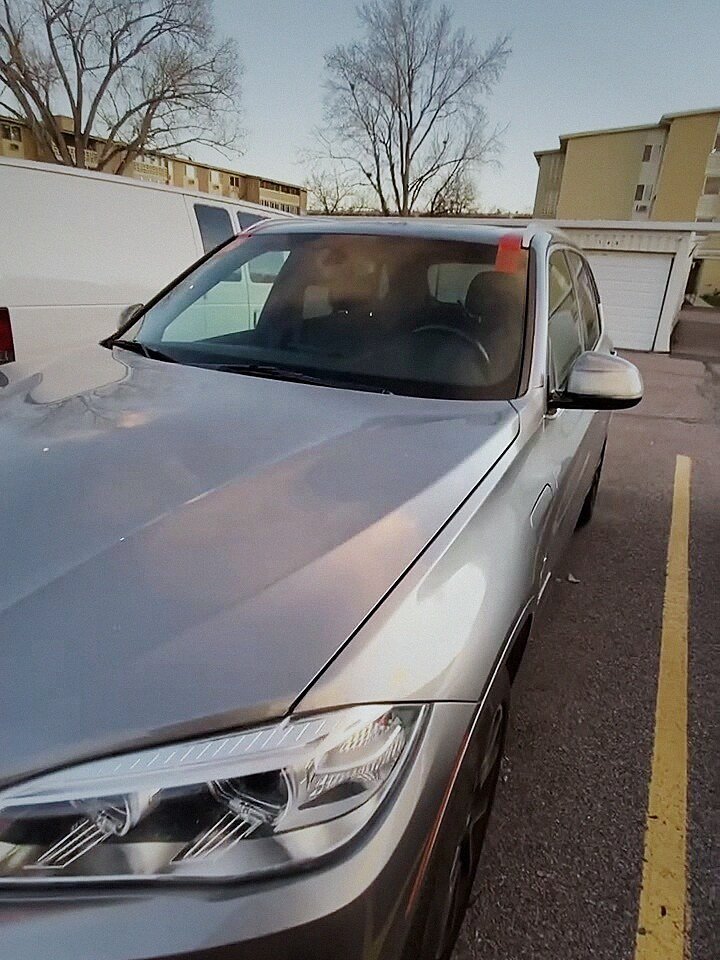 BMW X5 with a freshly installed windshield after same-day replacement in Denver
