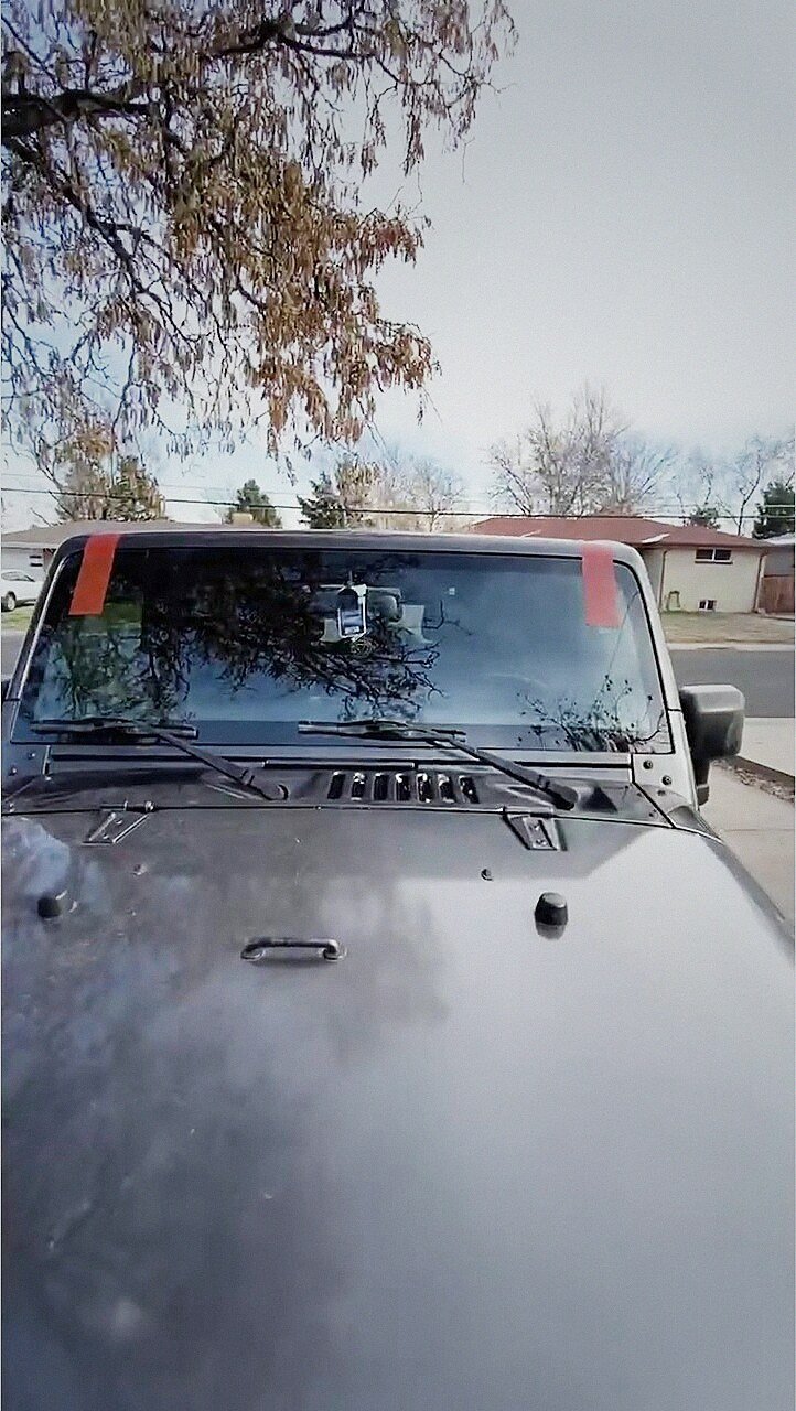 Black Jeep Gladiator with a new windshield set and sealed