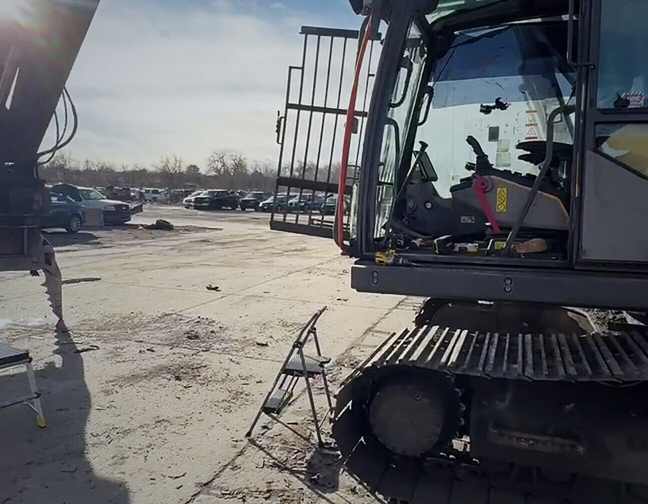 Excavator cab glass replacement at a Denver job site